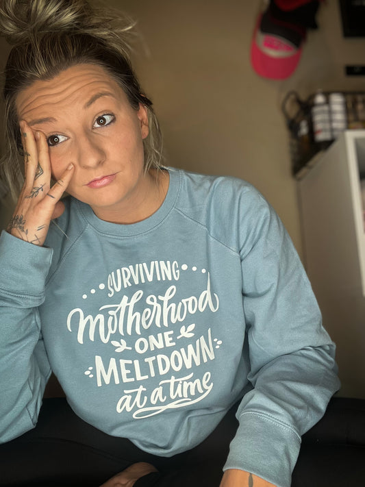 Surviving Motherhood One Meltdown at a Time Crewneck